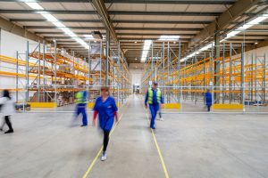 Staff walking away from racking during a warehouse racking inspection